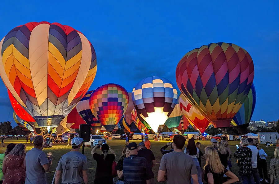 Illuminated hot air balloons glowing at night during the Great Forest Park Balloon Glow event