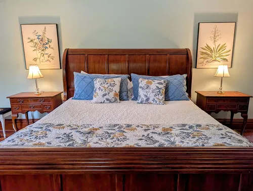 Grand carved king sleigh bed headboard with botanical prints