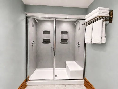 Double shower with fresh white towels