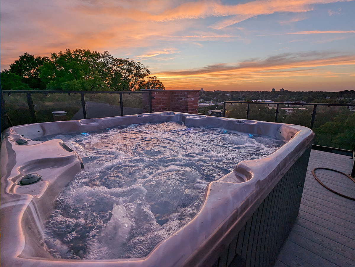 Rooftop hot tub at sunset — Gothic Heights Inn, St. Louis