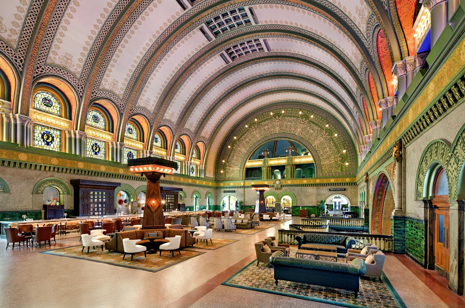 The Grand Hall at St. Louis Union Station Hotel showing the 65-foot barrel-vaulted ceiling, ornate arches, and stained glass windows