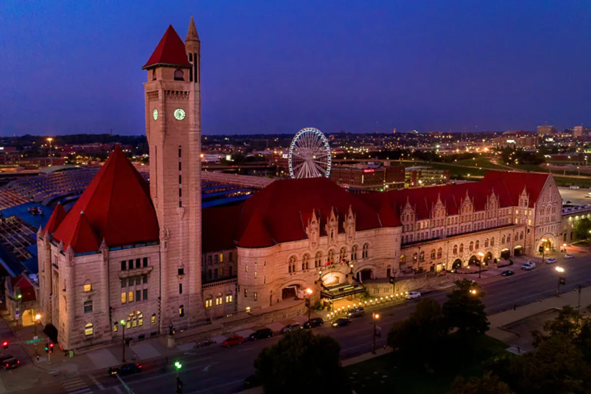 Aerial view of St. Louis Union Station Hotel at night with the Ferris wheel visible behind the clock tower